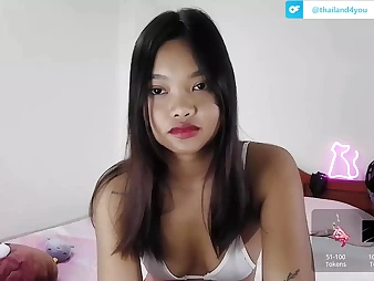 Watch this steamy Asian teenager with a Thai twist live on web cam